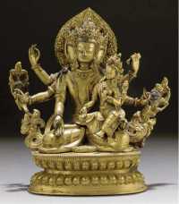 17th/18th Century. A Tibetan gilt-copper model of a bodhisattva and consort